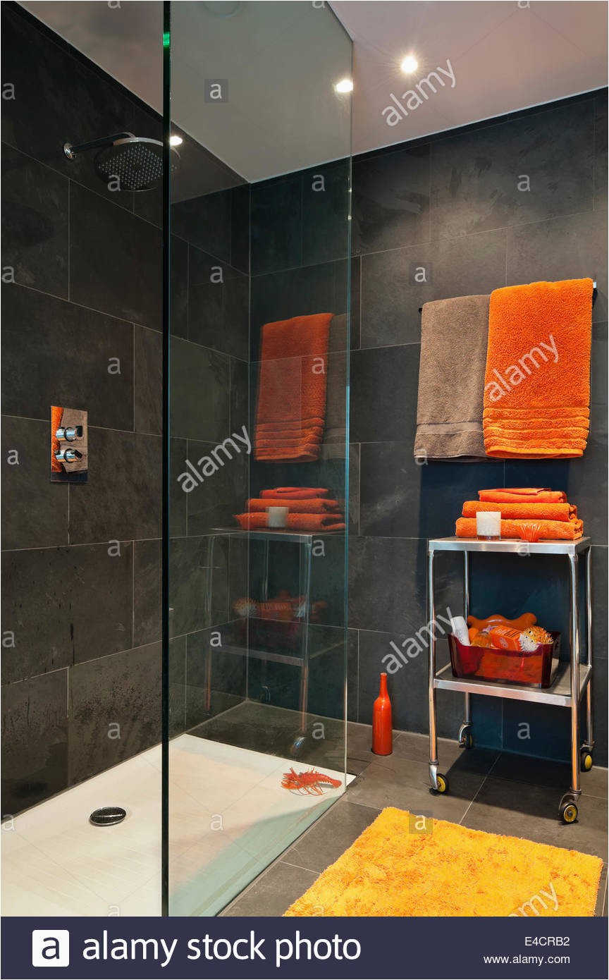 bright orange towels in bathroom with slate tiles E4CRB2
