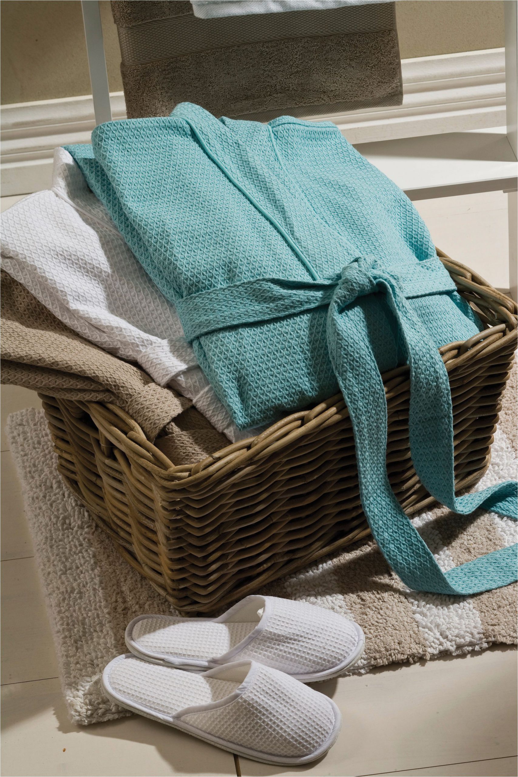 Silver Bath towels and Rugs Coordinate the Bliss Waffle Robe and Slippers to Evoke A