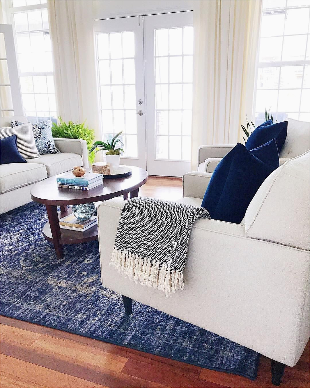 Rug with Blue Accents Living Room with Blue Accents Velvet Pillows and Vintage
