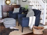 Navy Blue Cowhide Rug Living Room with Abstract Art Navy Chairs Jute Rug & Faux