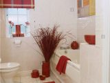 Red and White Bath Rug Arrangement Of Red Twigs Beside Bath In White Bathroom with