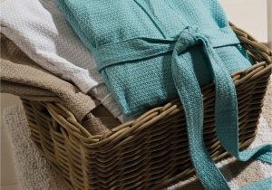 Silver Bath towels and Rugs Coordinate the Bliss Waffle Robe and Slippers to Evoke A