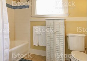 Yellow and White Bathroom Rug Yellow and Beige Cozy Bathroom Stock Download Image now